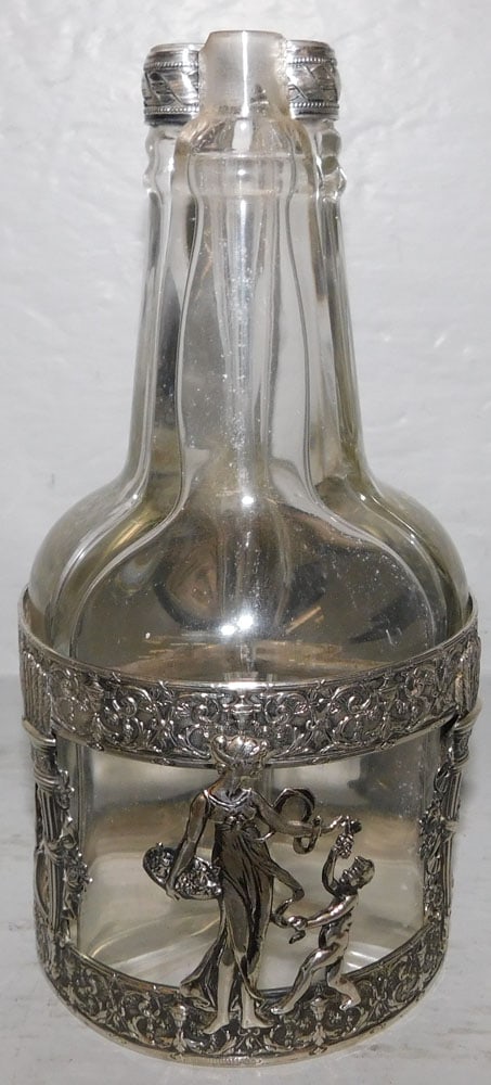 Three Bottle Silver Cruet Stand, One Bottle As Is: Three Bottle Silver Cruet Stand, One Bottle As Is. 7 3/4" H 3 3/4" Dia. ALL DESCRIPTIONS AND ANY CONDITION STATEMENT GIVEN BY LANGSTON AUCTION GALLERY ARE STRICTLY OPINIONS AND LANGSTON'S SHALL HAVE