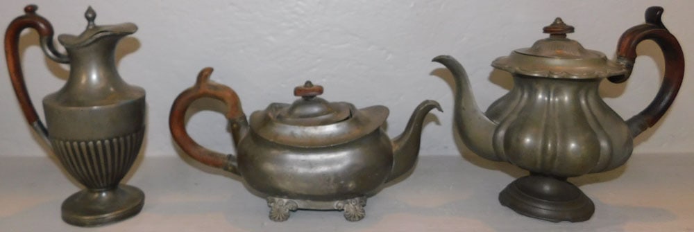 Three Antique Pewter Teapots: Three Antique Pewter Teapots. Up to 8 3/4" H 10 1/4" W ALL DESCRIPTIONS AND ANY CONDITION STATEMENT GIVEN BY LANGSTON AUCTION GALLERY ARE STRICTLY OPINIONS AND LANGSTON'S SHALL HAVE NO RESPONSIBILITY