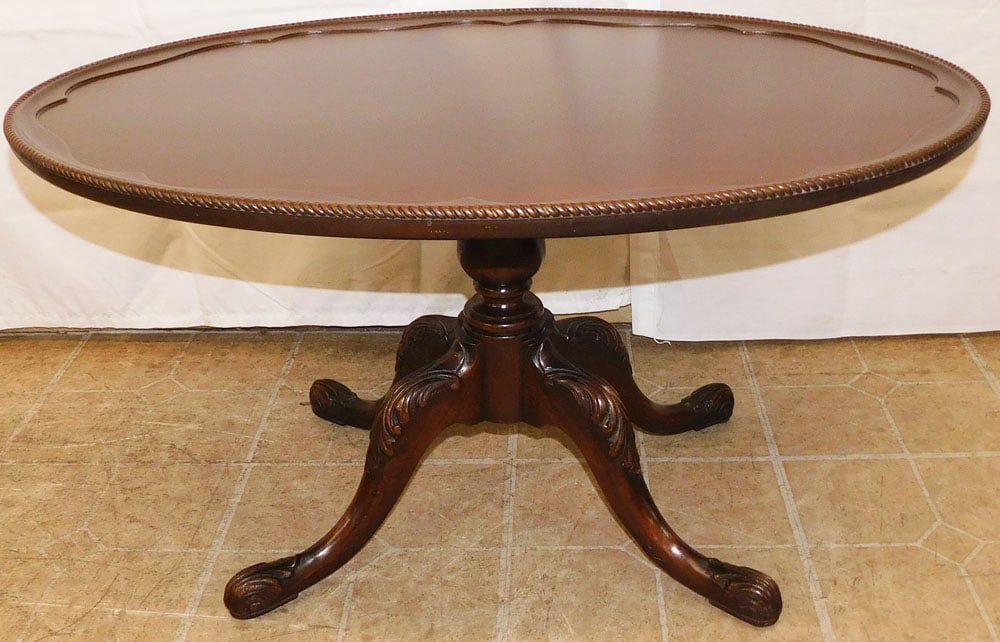 Oval Carved Mahogany Tea Table by Brandt: Oval Carved Mahogany Tea Table by Brandt. 18 1/2" H 33" W 22" D ALL DESCRIPTIONS AND ANY CONDITION STATEMENT GIVEN BY LANGSTON AUCTION GALLERY ARE STRICTLY OPINIONS AND LANGSTON'S SHALL HAVE NO RESPON