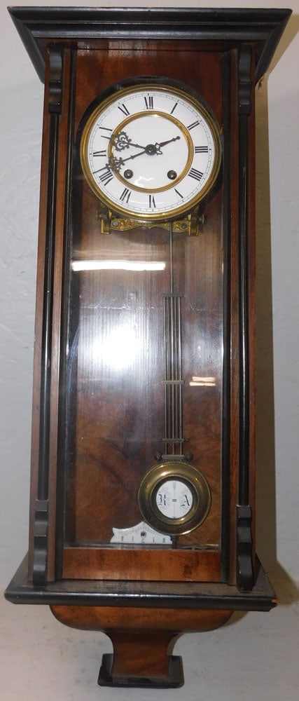 Antique Walnut Vienna Regulator: Antique Walnut Vienna Regulator. 26" H 9 1/2" W 6 1/4" D ALL DESCRIPTIONS AND ANY CONDITION STATEMENT GIVEN BY LANGSTON AUCTION GALLERY ARE STRICTLY OPINIONS AND LANGSTON'S SHALL HAVE NO RESPONSIBILIT
