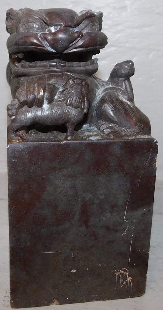 Carved Soapstone Foo Dog Book End: Carved Soapstone Foo Dog Book End . 6 1/2" H 3 1/4" Dia. ALL DESCRIPTIONS AND ANY CONDITION STATEMENT GIVEN BY LANGSTON AUCTION GALLERY ARE STRICTLY OPINIONS AND LANGSTON'S SHALL HAVE NO