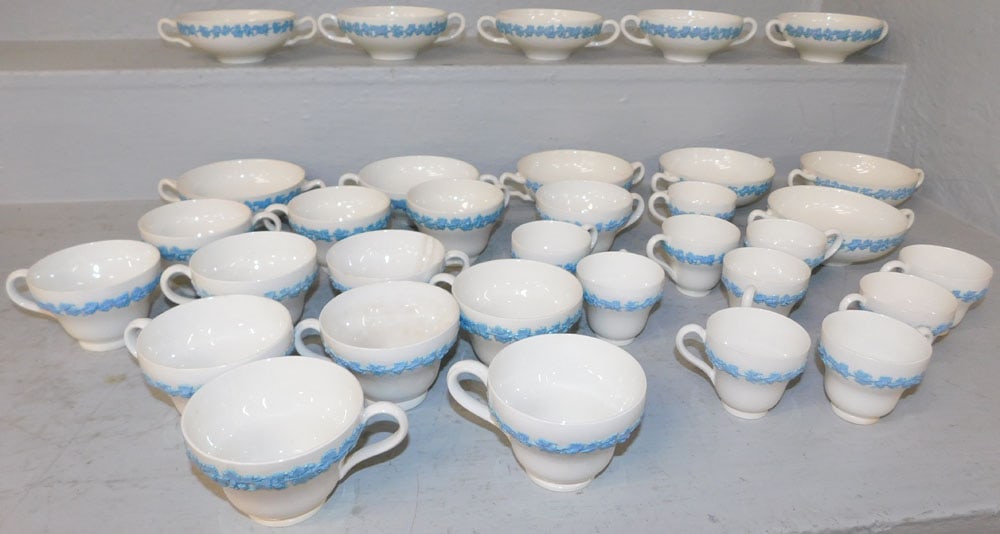 Lot of Thirty Two Wedgwood Embossed Queen's Ware Cups: Lot of Thirty Two Wedgwood Embossed Queen's Ware Cups. Up to 2" H 6 3/4" W ALL DESCRIPTIONS AND ANY CONDITION STATEMENT GIVEN BY LANGSTON AUCTION GALLERY ARE STRICTLY OPINIONS AND LANGSTON'S SHALL