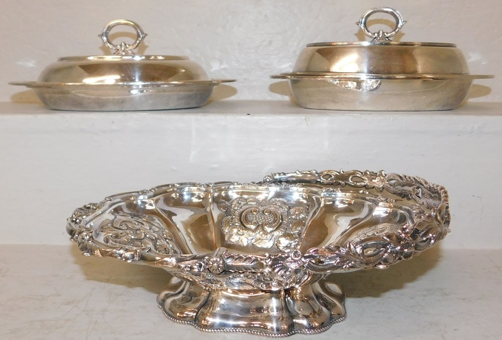 Two Silverplated Covered Dishes & Basket: Two Silverplated Covered Dishes & Basket. Up to 3 3/4" H 12 1/2" W 10 1/4" D ALL DESCRIPTIONS AND ANY CONDITION STATEMENT GIVEN BY LANGSTON AUCTION GALLERY ARE STRICTLY OPINIONS AND LANGSTON'S SHALL