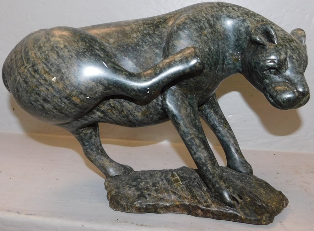 Carved Stone Panther Sculpture: Carved Stone Panther Sculpture. 8 1/2" H 12 1/2" W ALL DESCRIPTIONS AND ANY CONDITION STATEMENT GIVEN BY LANGSTON AUCTION GALLERY ARE STRICTLY OPINIONS AND LANGSTON'S SHALL HAVE NO RESPONSIBILITY FOR