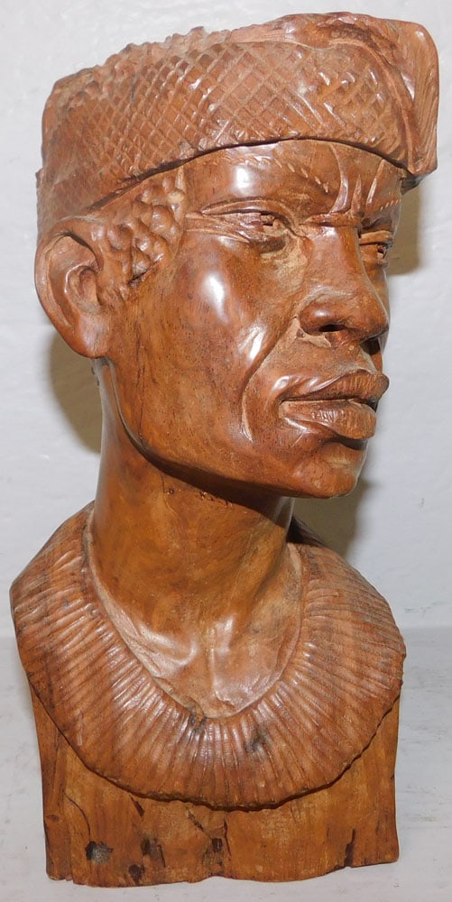 Carved Wood African Bust: Carved Wood African Bust . 11" H 5 1/2" W ALL DESCRIPTIONS AND ANY CONDITION STATEMENT GIVEN BY LANGSTON AUCTION GALLERY ARE STRICTLY OPINIONS AND LANGSTON'S SHALL HAVE NO RESPONSIBILITY FOR ERRORS OR