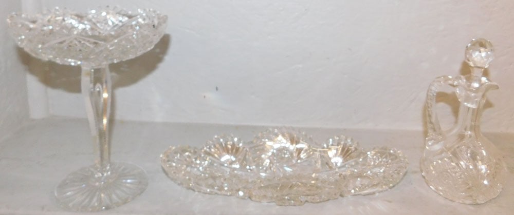 Three Pieces of Cut Glass: Three Pieces of Cut Glass . Up to 7 1/2" H 6" Dia. ALL DESCRIPTIONS AND ANY CONDITION STATEMENT GIVEN BY LANGSTON AUCTION GALLERY ARE STRICTLY OPINIONS AND LANGSTON'S SHALL HAVE NO RESPONSIBILITY FOR