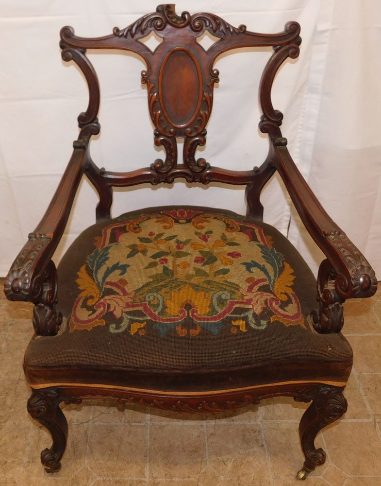 Antique Carved Mahogany Chair with Needlepoint Seat: Antique Carved Mahogany Chair with Needlepoint Seat . 37" H 26" W 22" D ALL DESCRIPTIONS AND ANY CONDITION STATEMENT GIVEN BY LANGSTON AUCTION GALLERY ARE STRICTLY OPINIONS AND LANGSTON'S SHALL HAVE