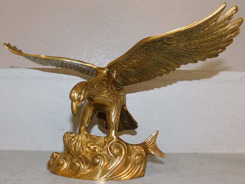 Brass Eagle Sculpture: Brass Eagle Sculpture. 7 1/4" H 12 1/2" W ALL DESCRIPTIONS AND ANY CONDITION STATEMENT GIVEN BY LANGSTON AUCTION GALLERY ARE STRICTLY OPINIONS AND LANGSTON'S SHALL HAVE NO RESPONSIBILITY FOR ERRORS