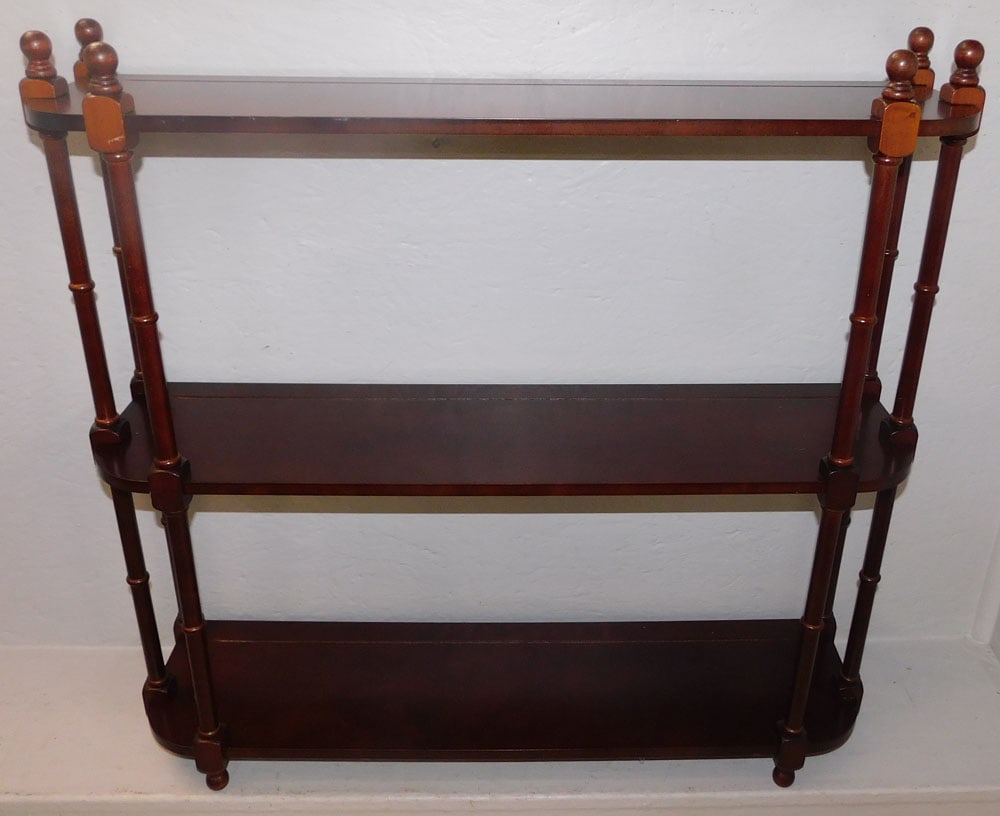 Hanging Mahogany Wall Shelf by Bombay: Hanging Mahogany Wall Shelf by Bombay . 29 1/4" H 31" W 8 1/4" D ALL DESCRIPTIONS AND ANY CONDITION STATEMENT GIVEN BY LANGSTON AUCTION GALLERY ARE STRICTLY OPINIONS AND LANGSTON'S SHALL HAVE NO