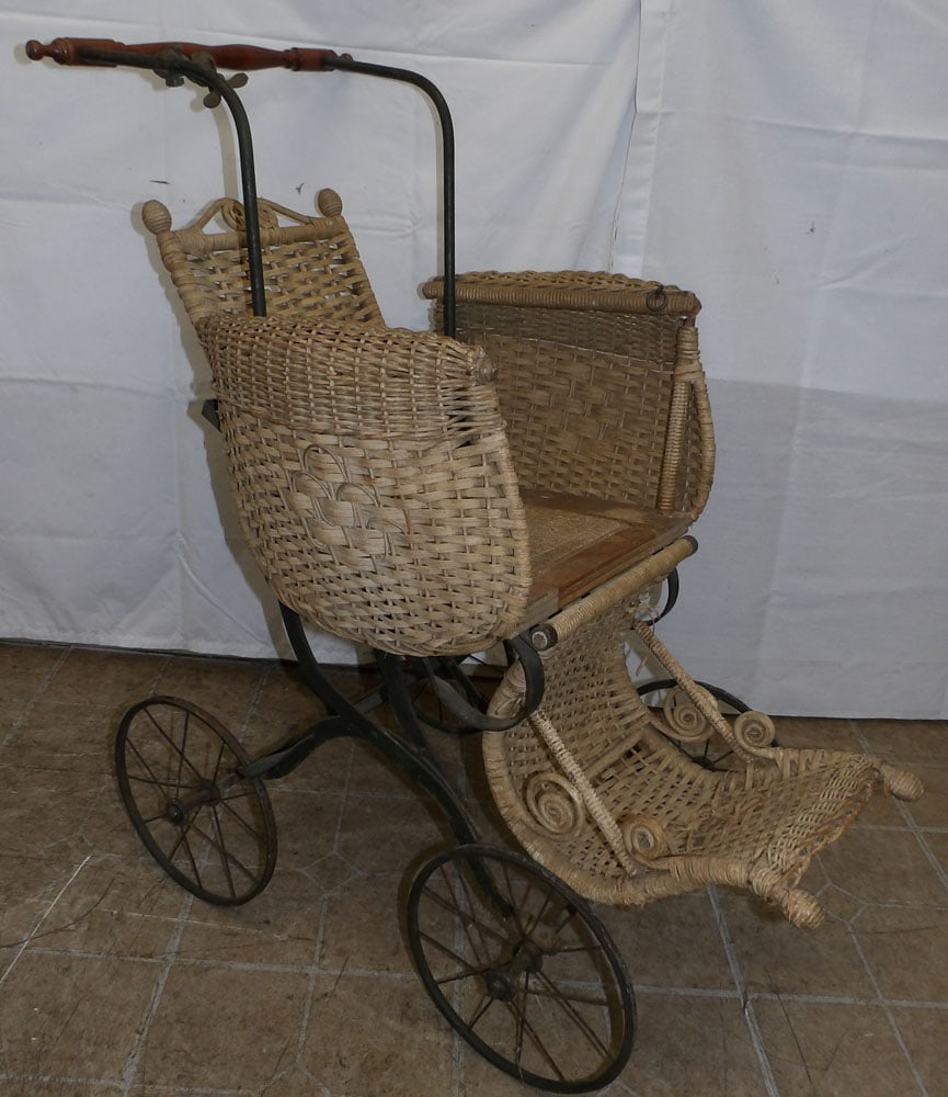 Antique Wicker Baby Carriage: Antique Wicker Baby Carriage . 53 1/4" H 19 1/2" W 34" D ALL DESCRIPTIONS AND ANY CONDITION STATEMENT GIVEN BY LANGSTON AUCTION GALLERY ARE STRICTLY OPINIONS AND LANGSTON'S SHALL HAVE NO