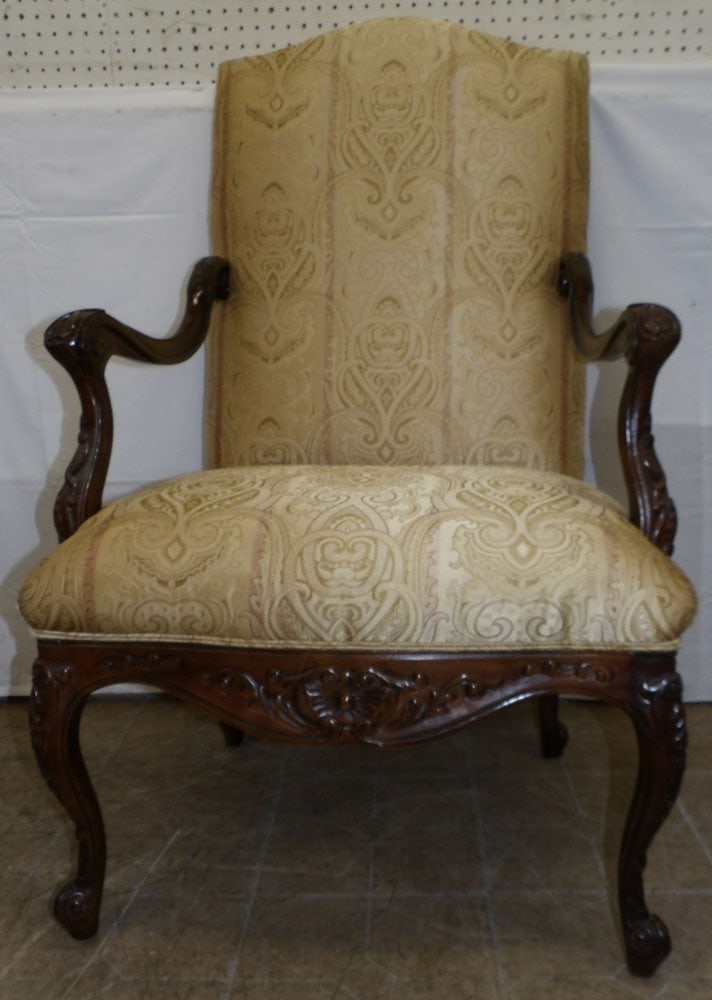 Carved Walnut & Upholstered Arm Chair: Carved Walnut & Upholstered Arm Chair . 46" H 28" W 24" D ALL DESCRIPTIONS AND ANY CONDITION STATEMENT GIVEN BY LANGSTON AUCTION GALLERY ARE STRICTLY OPINIONS AND LANGSTON'S SHALL HAVE NO