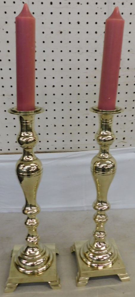 Pair of Tall Cast Brass Candlesticks: Pair of Tall Cast Brass Candlesticks. 17 3/4" H 5 1/2" Dia. ALL DESCRIPTIONS AND ANY CONDITION STATEMENT GIVEN BY LANGSTON AUCTION GALLERY ARE STRICTLY OPINIONS AND LANGSTON'S SHALL HAVE NO RESPONSIBI