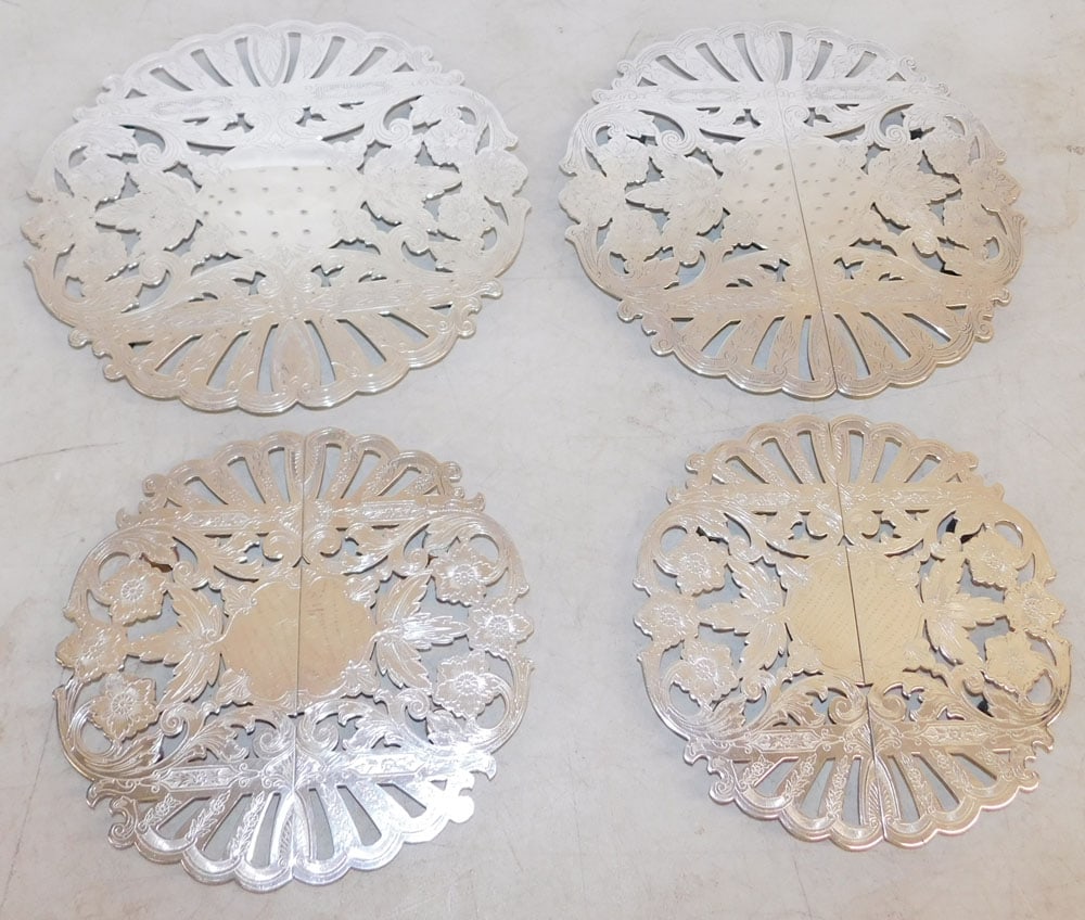 Four Silverplated Trivets: Four Silverplated Trivets. Up to 10 1/4" Dia. ALL DESCRIPTIONS AND ANY CONDITION STATEMENT GIVEN BY LANGSTON AUCTION GALLERY ARE STRICTLY OPINIONS AND LANGSTON'S SHALL HAVE NO RESPONSIBILITY FOR