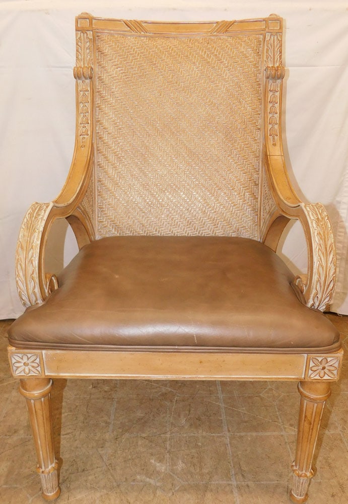 Carved Wood & Rattan Leather Seat Arm Chair: Carved Wood & Rattan Leather Seat Arm Chair . 41" H 25" W 25" D ALL DESCRIPTIONS AND ANY CONDITION STATEMENT GIVEN BY LANGSTON AUCTION GALLERY ARE STRICTLY OPINIONS AND LANGSTON'S SHALL HAVE NO