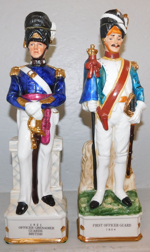 Pair of Painted Porcelain Soldier Figure Decanters: Pair of Painted Porcelain Soldier Figure Decanters. 14" H 4 1/2 W ALL DESCRIPTIONS AND ANY CONDITION STATEMENT GIVEN BY LANGSTON AUCTION GALLERY ARE STRICTLY OPINIONS AND LANGSTON'S SHALL HAVE NO RESP