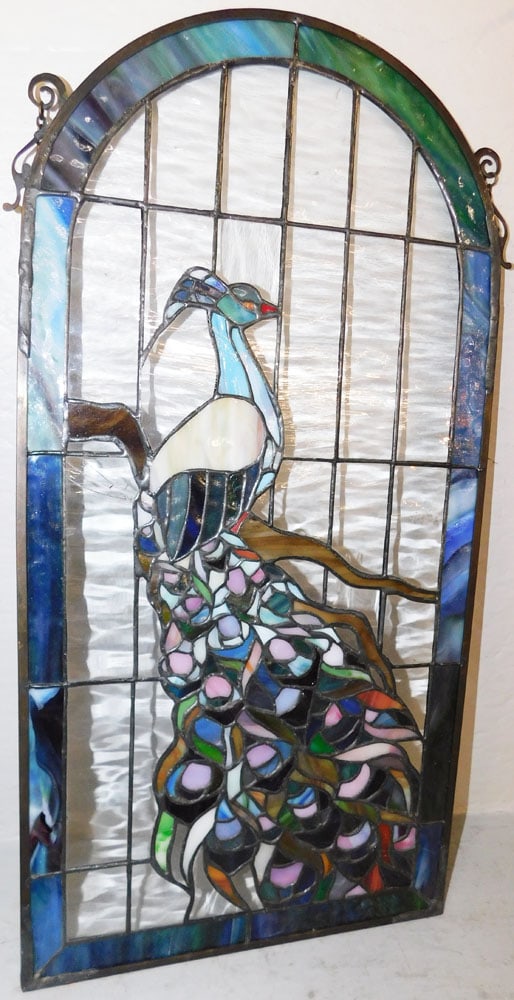 Leaded & Stained Glass Peacock Sun Catcher: Leaded & Stained Glass Peacock Sun Catcher . 24 1/4" x 12 3/4" ALL DESCRIPTIONS AND ANY CONDITION STATEMENT GIVEN BY LANGSTON AUCTION GALLERY ARE STRICTLY OPINIONS AND LANGSTON'S SHALL HAVE NO RESPONS