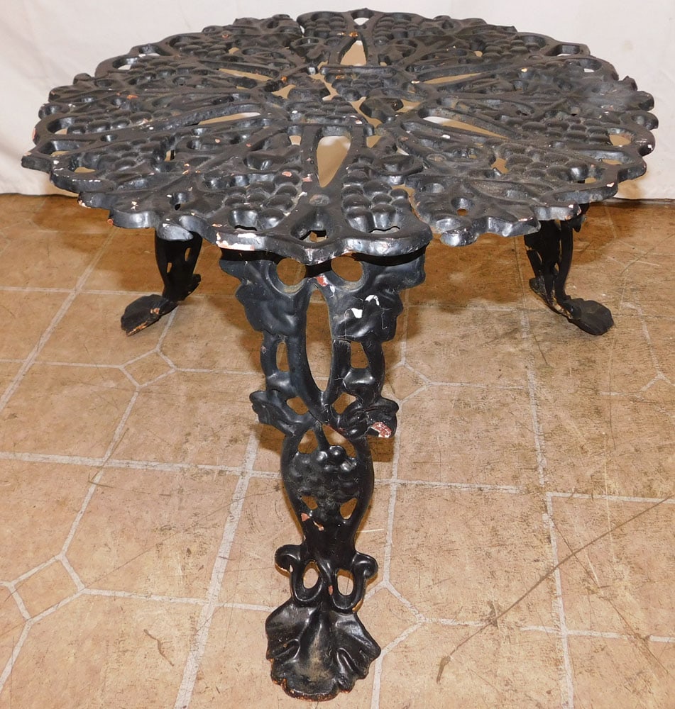 Painted Cast Iron Outdoor Table with Grape & Cable Motif: Painted Cast Iron Outdoor Table with Grape & Cable Motif . 14 1/2" H 24 1/2" Dia. ALL DESCRIPTIONS AND ANY CONDITION STATEMENT GIVEN BY LANGSTON AUCTION GALLERY ARE STRICTLY OPINIONS AND LANGSTON'S SH