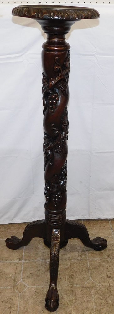 Carved Mahogany Fern Stand with Ball & Claw Feet: Carved Mahogany Fern Stand with Ball & Claw Feet. 42 1/2" H 19" Dia. ALL DESCRIPTIONS AND ANY CONDITION STATEMENT GIVEN BY LANGSTON AUCTION GALLERY ARE STRICTLY OPINIONS AND LANGSTON'S SHALL HAVE NO R