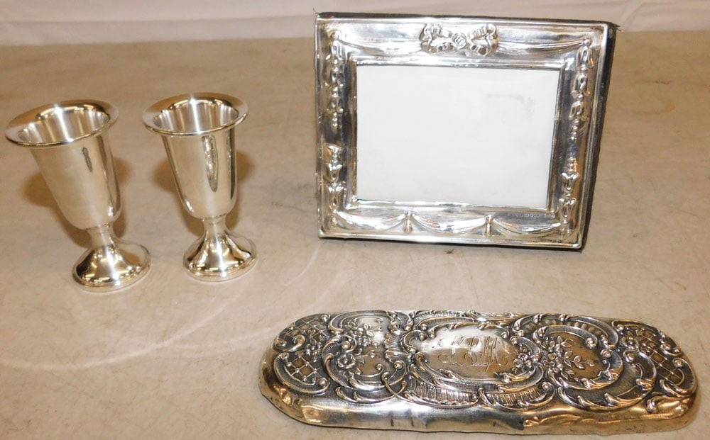 Two Sterling Weighted Cordials, Sterling Frame, & Sterling Brush Handle Cover: Two Sterling Weighted Cordials, Sterling Frame, & Sterling Brush Handle Cover. Up to 6 1/2" x 2 1/4" ALL DESCRIPTIONS AND ANY CONDITION STATEMENT GIVEN BY LANGSTON AUCTION GALLERY ARE STRICTLY OPINION