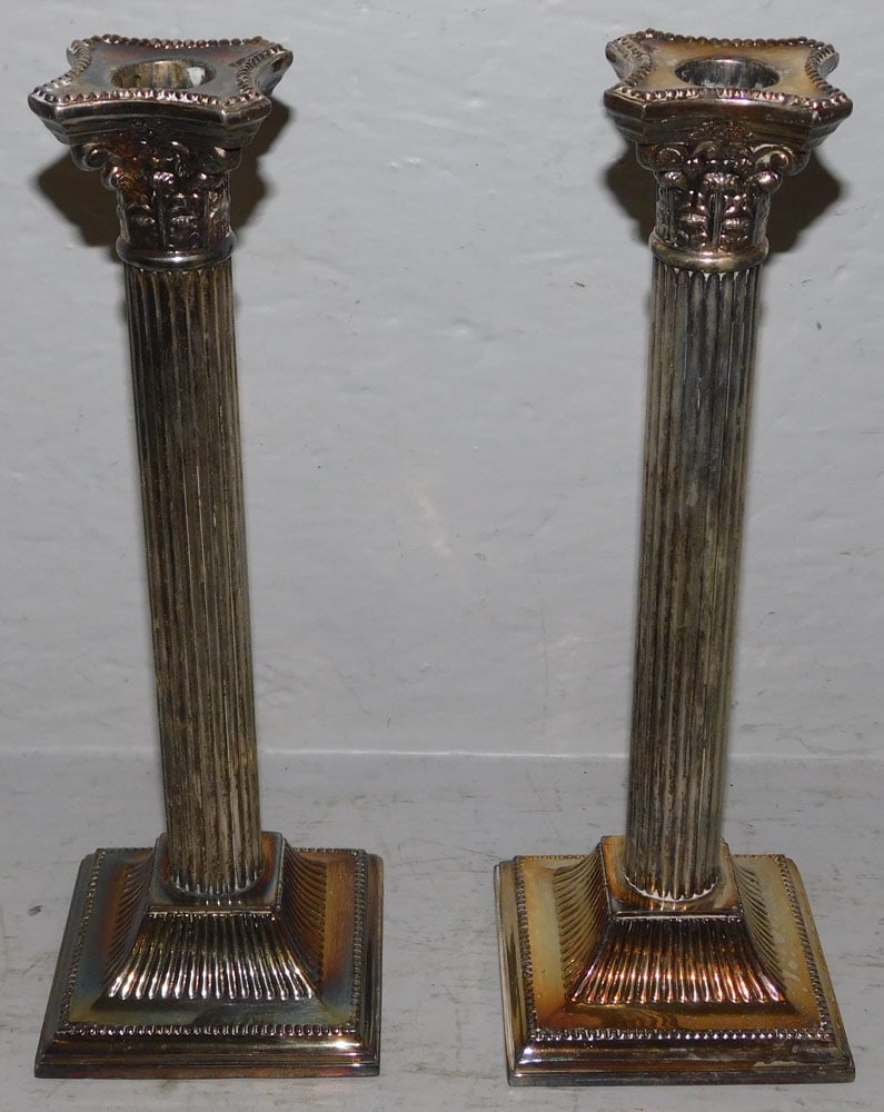 Pair of Silverplated Corinthian Column Candlesticks: Pair of Silverplated Corinthian Column Candlesticks. 10" H 3 1/2" Dia. ALL DESCRIPTIONS AND ANY CONDITION STATEMENT GIVEN BY LANGSTON AUCTION GALLERY ARE STRICTLY OPINIONS AND LANGSTON'S SHALL HAVE
