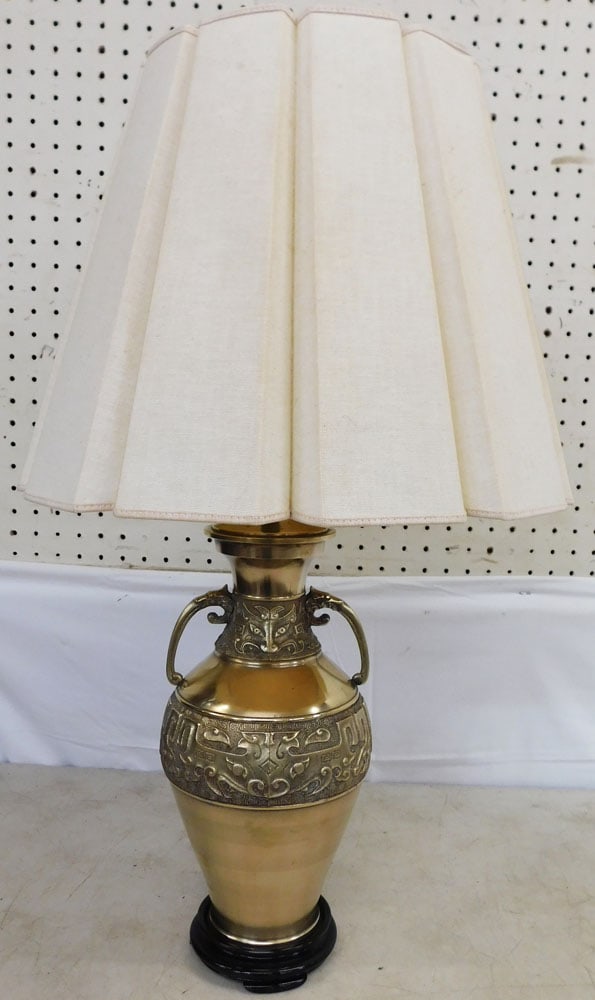 Oriental Brass Urn Made Into Lamp: Oriental Brass Urn Made Into Lamp . 28" H Shade: 16 1/4" Dia. ALL DESCRIPTIONS AND ANY CONDITION STATEMENT GIVEN BY LANGSTON AUCTION GALLERY ARE STRICTLY OPINIONS AND LANGSTON'S SHALL HAVE NO