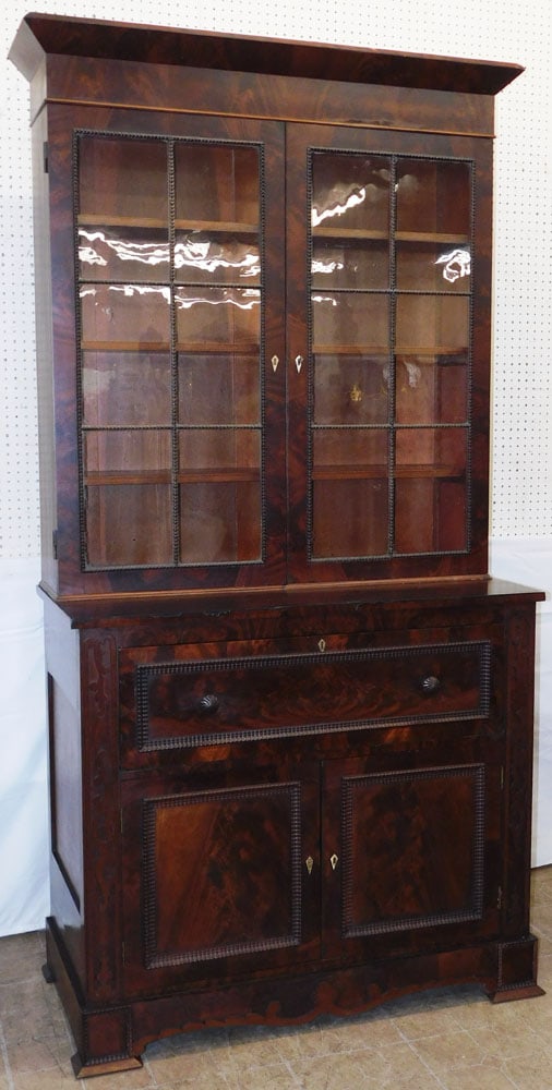 19th Century Two Piece Flame Mahogany Empire Butler's Desk Secretary: 19th Century Two Piece Flame Mahogany Empire Butler's Desk Secretary . 93 1/2" H 46 1/2" W 22 1/2" D ALL DESCRIPTIONS AND ANY CONDITION STATEMENT GIVEN BY LANGSTON AUCTION GALLERY ARE STRICTLY OPINION