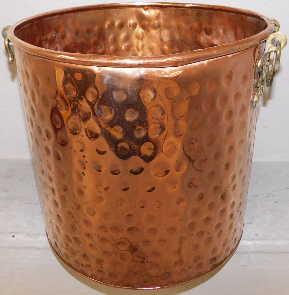 Two Handled Copper Jardiniere: Two Handled Copper Jardiniere . 11 3/4" H 13" Dia. ALL DESCRIPTIONS AND ANY CONDITION STATEMENT GIVEN BY LANGSTON AUCTION GALLERY ARE STRICTLY OPINIONS AND LANGSTON'S SHALL HAVE NO RESPONSIBILITY FOR 