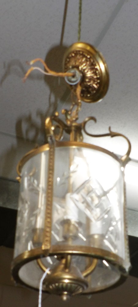 Brass & Cut Glass Four Light Foyer Chandelier: Brass & Cut Glass Four Light Foyer Chandelier. 15" H 8" Dia. ALL DESCRIPTIONS AND ANY CONDITION STATEMENT GIVEN BY LANGSTON AUCTION GALLERY ARE STRICTLY OPINIONS AND LANGSTON'S SHALL HAVE NO