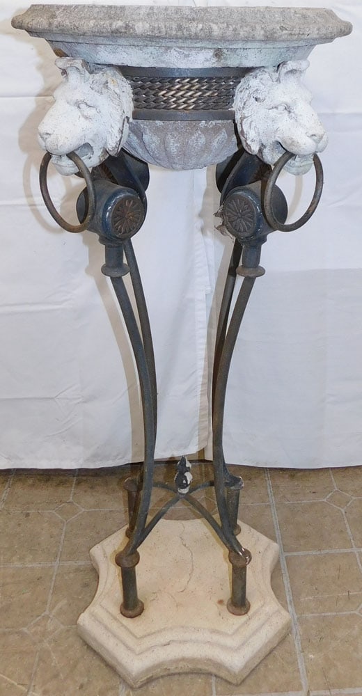 Wrought Iron & Plaster Planter with Lion Head Motif: Wrought Iron & Plaster Planter with Lion Head Motif. 41 1/2" H 19" Dia. ALL DESCRIPTIONS AND ANY CONDITION STATEMENT GIVEN BY LANGSTON AUCTION GALLERY ARE STRICTLY OPINIONS AND LANGSTON'S SHALL HAVE