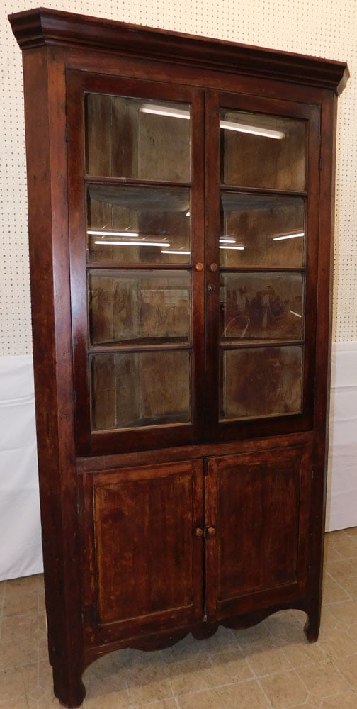 19th Century Cherry One Piece Glass Door Corner Cabinet: 19th Century Cherry One Piece Glass Door Corner Cabinet . 85 1/4" H 46" W 21" D ALL DESCRIPTIONS AND ANY CONDITION STATEMENT GIVEN BY LANGSTON AUCTION GALLERY ARE STRICTLY OPINIONS AND LANGSTON'S
