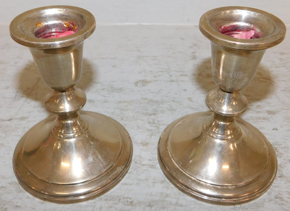 Pair Sterling Weighted Candlesticks by Towle: Pair Sterling Weighted Candlesticks by Towle. 4 1/2" H 3 1/2" Dia. ALL DESCRIPTIONS AND ANY CONDITION STATEMENT GIVEN BY LANGSTON AUCTION GALLERY ARE STRICTLY OPINIONS AND LANGSTON'S SHALL HAVE NO RES