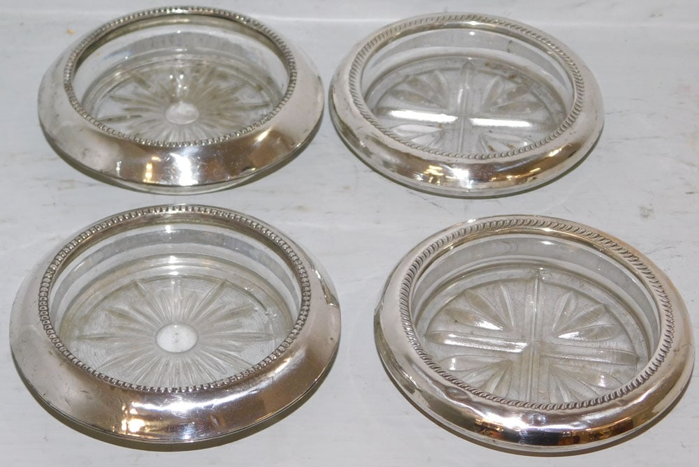 Four Sterling Rim Coasters,: Four Sterling Rim Coasters, . 3 3/4" Dia. ALL DESCRIPTIONS AND ANY CONDITION STATEMENT GIVEN BY LANGSTON AUCTION GALLERY ARE STRICTLY OPINIONS AND LANGSTON'S SHALL HAVE NO RESPONSIBILITY FOR ERRORS