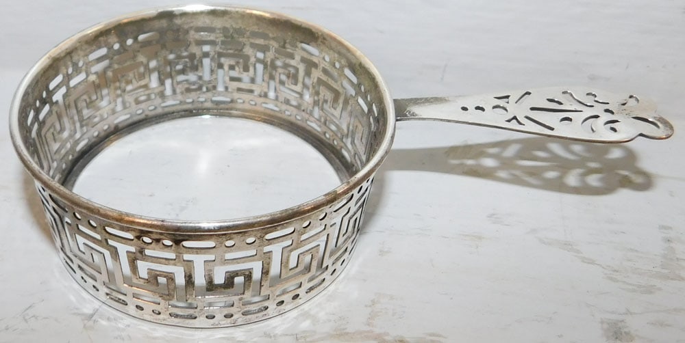 Sterling Cup Holder, 1.36 ozt: Sterling Cup Holder, 1.36 ozt. 1 1/4" H 5 1/2" W ALL DESCRIPTIONS AND ANY CONDITION STATEMENT GIVEN BY LANGSTON AUCTION GALLERY ARE STRICTLY OPINIONS AND LANGSTON'S SHALL HAVE NO RESPONSIBILITY FOR