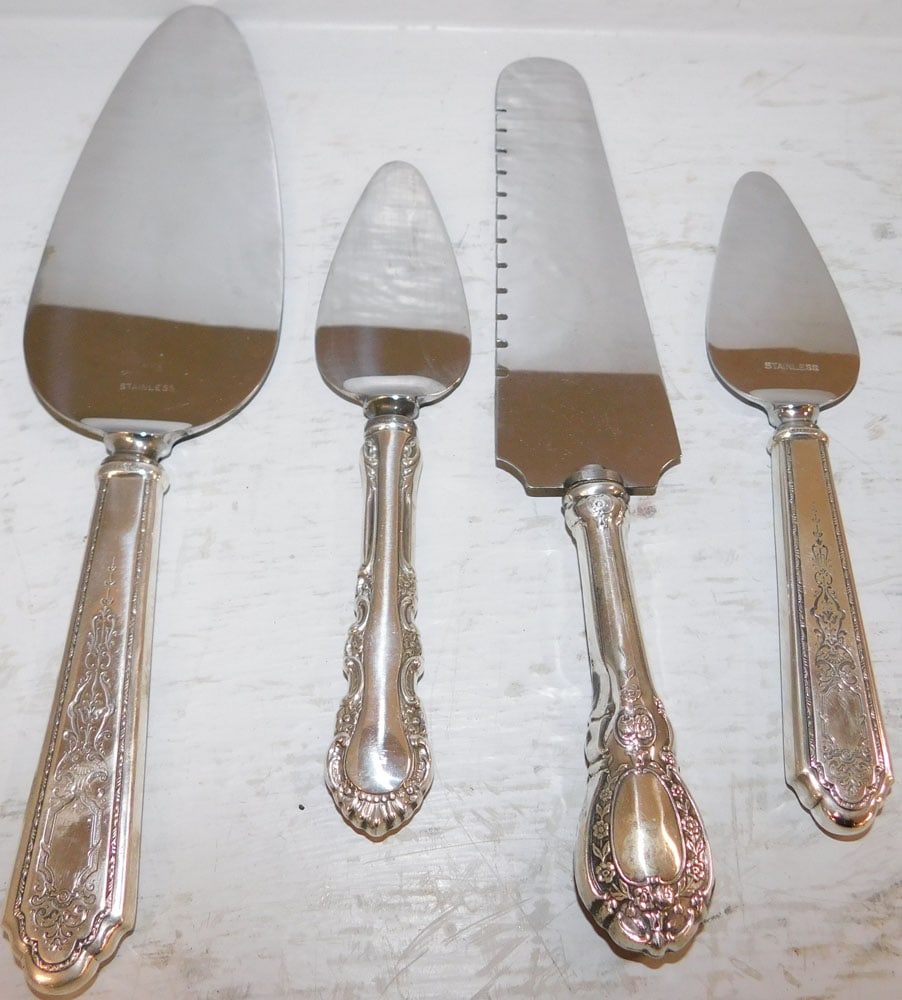 Four Sterling Handle Serving Pieces: Four Sterling Handle Serving Pieces. 9 3/4" L 2 1/4" W ALL DESCRIPTIONS AND ANY CONDITION STATEMENT GIVEN BY LANGSTON AUCTION GALLERY ARE STRICTLY OPINIONS AND LANGSTON'S SHALL HAVE NO RESPONSIBILITY 