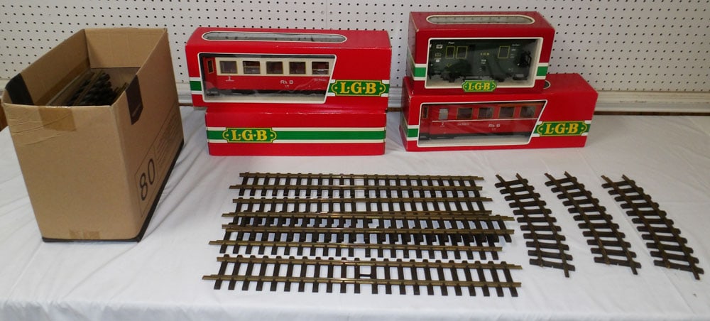 Lot of Lehman Train Cars in Boxes & Track: Lot of Lehman Train Cars in Boxes & Track. Up to 7" H 20 1/4" W "ALL DESCRIPTIONS AND ANY CONDITION STATEMENT GIVEN BY LANGSTON AUCTION GALLERY ARE STRICTLY OPINIONS AND LANGSTON'S SHALL HAVE NO RESPO
