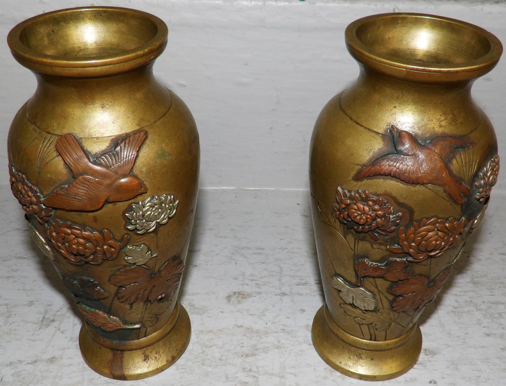 Pair of Antique Brass High Relief Vases: Pair of Antique Brass High Relief Vases. 7" H 3 1/4" Dia. "ALL DESCRIPTIONS AND ANY CONDITION STATEMENT GIVEN BY LANGSTON AUCTION GALLERY ARE STRICTLY OPINIONS AND LANGSTON'S SHALL HAVE NO