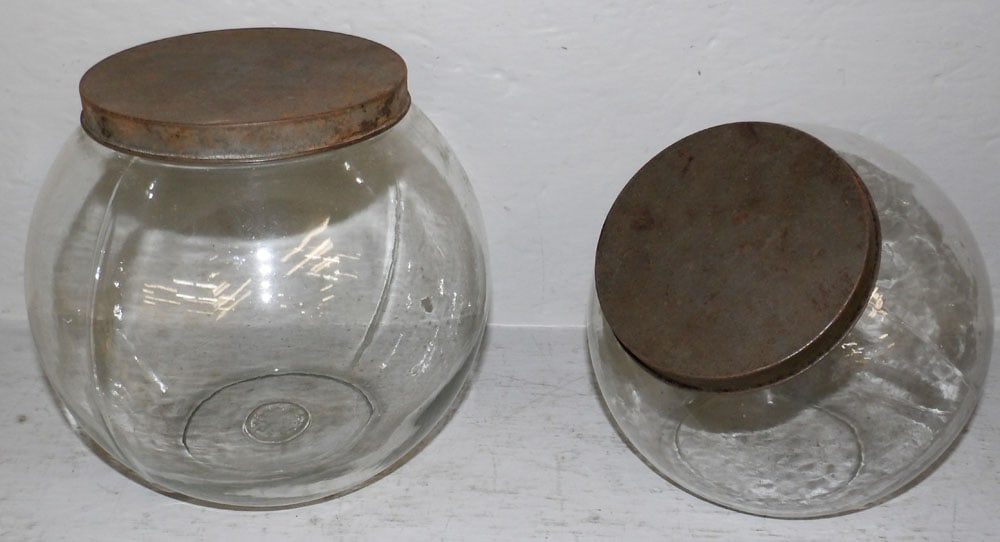 Two Vintage Glass Country Store Jars with Tole Decorated Lids: Two Vintage Glass Country Store Jars with Tole Decorated Lids. 7 1/4" H 7 1/2" Dia. "ALL DESCRIPTIONS AND ANY CONDITION STATEMENT GIVEN BY LANGSTON AUCTION GALLERY ARE STRICTLY OPINIONS AND
