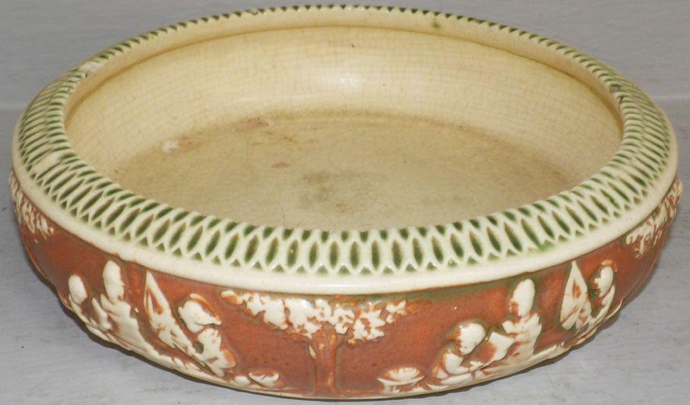 Roseville Donatello Planter, (As Found): Roseville Donatello Planter, (As Found). 3" H 11 1/2" Dia. "ALL DESCRIPTIONS AND ANY CONDITION STATEMENT GIVEN BY LANGSTON AUCTION GALLERY ARE STRICTLY OPINIONS AND LANGSTON'S SHALL HAVE NO