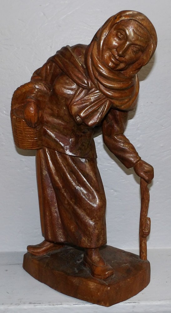 Carved Wood Statue of an Elderly Lady: Carved Wood Statue of an Elderly Lady . 19 1/2" H 11" W "ALL DESCRIPTIONS AND ANY CONDITION STATEMENT GIVEN BY LANGSTON AUCTION GALLERY ARE STRICTLY OPINIONS AND LANGSTON'S SHALL HAVE NO