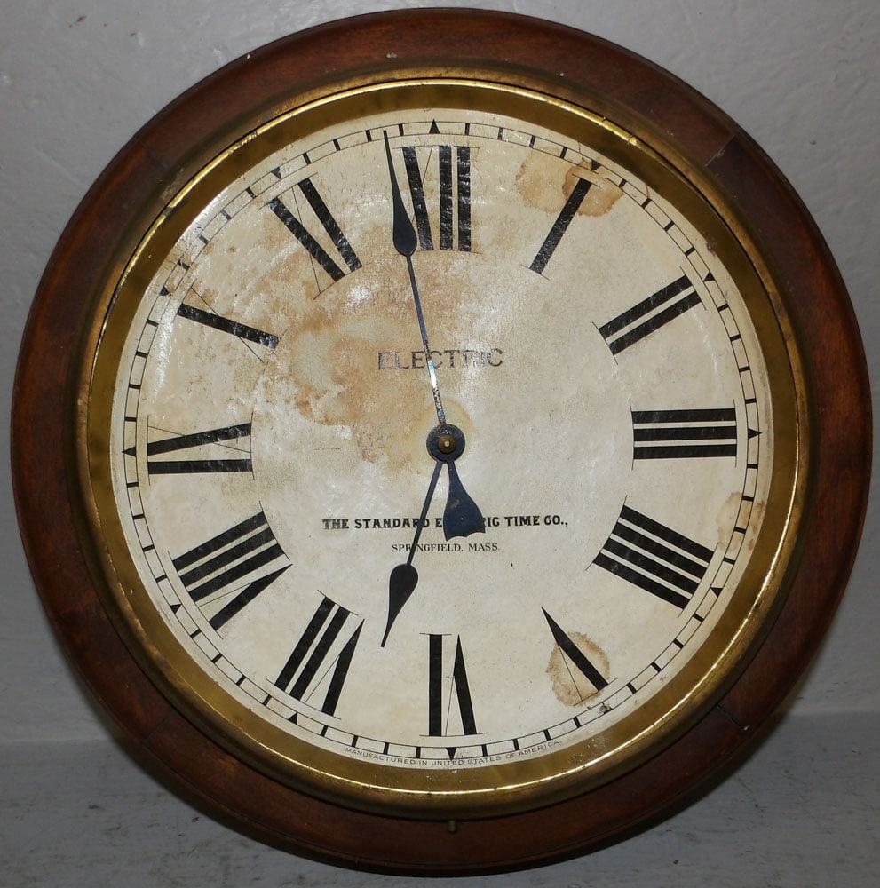 Walnut Wall Clock: Walnut Wall Clock. 16 3/4" Dia. "ALL DESCRIPTIONS AND ANY CONDITION STATEMENT GIVEN BY LANGSTON AUCTION GALLERY ARE STRICTLY OPINIONS AND LANGSTON'S SHALL HAVE NO RESPONSIBILITY FOR ERRORS OR