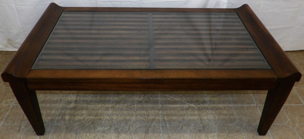 Modern Mahogany & Glass Top Cocktail Table: Modern Mahogany & Glass Top Cocktail Table. 19" H 52" W 28" D "ALL DESCRIPTIONS AND ANY CONDITION STATEMENT GIVEN BY LANGSTON AUCTION GALLERY ARE STRICTLY OPINIONS AND LANGSTON'S SHALL HAVE NO