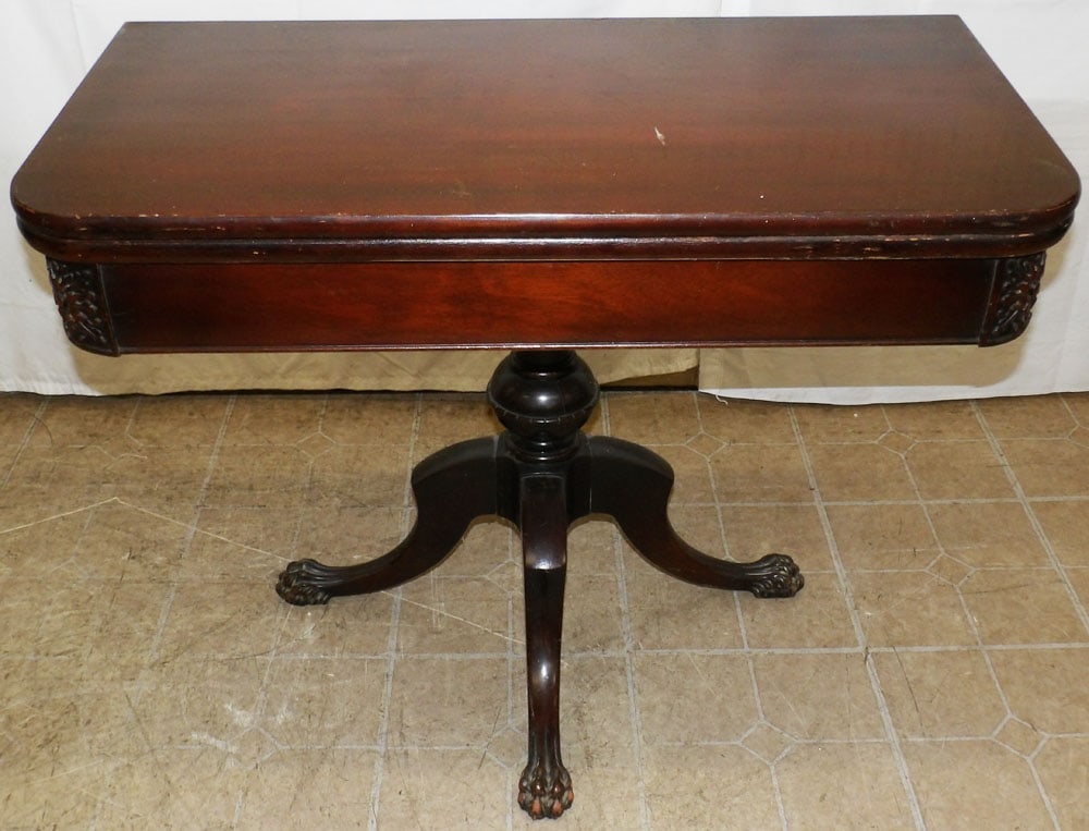 Mahogany Fold Over Top Game Table: Mahogany Fold Over Top Game Table. 29 1/2" H 35" W 17 1/2" D "ALL DESCRIPTIONS AND ANY CONDITION STATEMENT GIVEN BY LANGSTON AUCTION GALLERY ARE STRICTLY OPINIONS AND LANGSTON'S SHALL HAVE NO RESPONSI