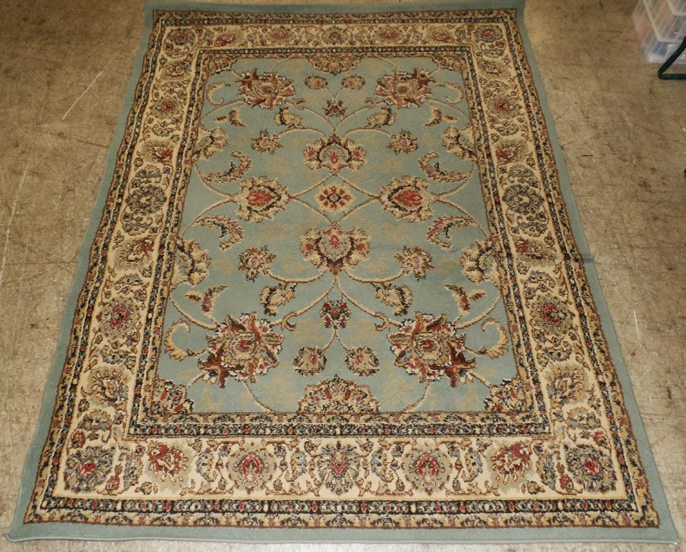 5' 3" x 6' 10" Machine Made Rug: 5' 3" x 6' 10" Machine Made Rug. "ALL DESCRIPTIONS AND ANY CONDITION STATEMENT GIVEN BY LANGSTON AUCTION GALLERY ARE STRICTLY OPINIONS AND LANGSTON'S SHALL HAVE NO RESPONSIBILITY FOR ERRORS OR