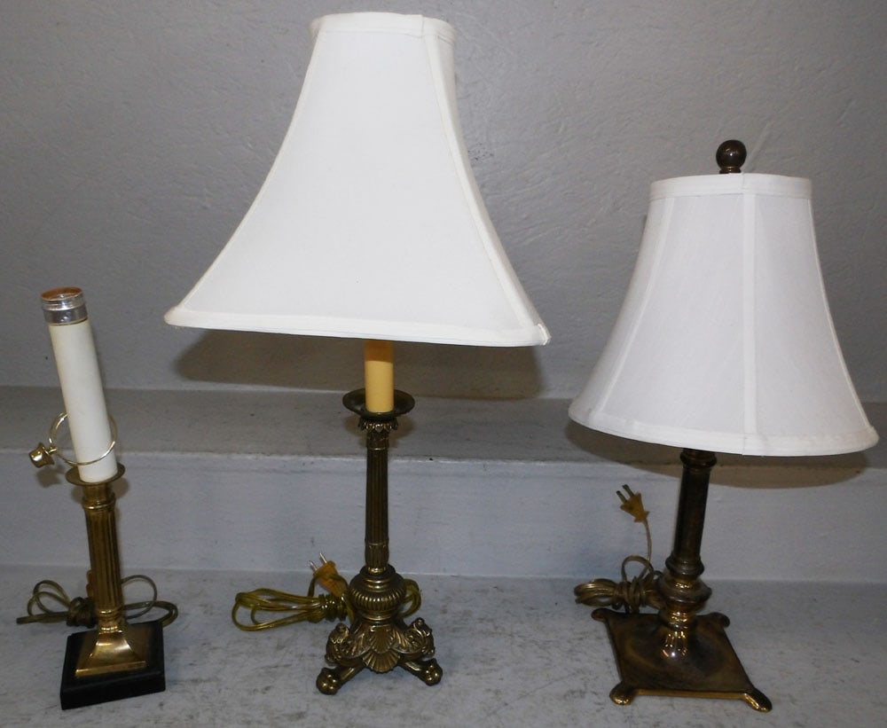 Three Brass Candlestick Lamps: Three Brass Candlestick Lamps . 23" H 11" Dia. "ALL DESCRIPTIONS AND ANY CONDITION STATEMENT GIVEN BY LANGSTON AUCTION GALLERY ARE STRICTLY OPINIONS AND LANGSTON'S SHALL HAVE NO RESPONSIBILITY FOR