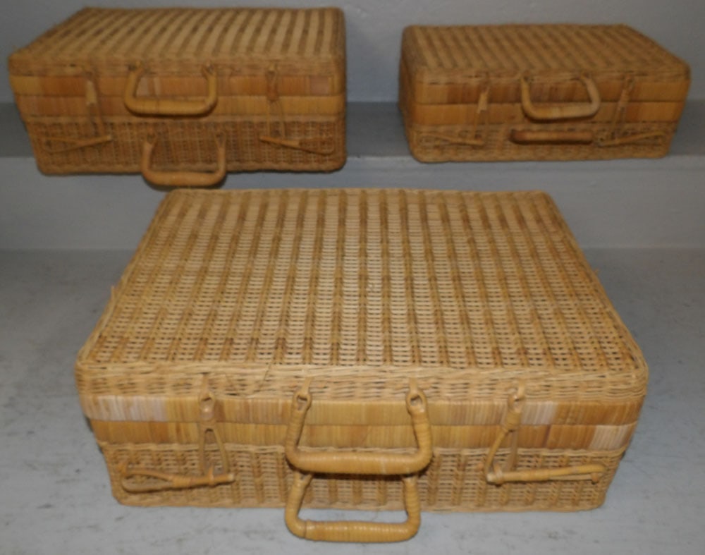 Set of Three Wicker Suitcases: Set of Three Wicker Suitcases. Up to 13" H 18" W 7" D "ALL DESCRIPTIONS AND ANY CONDITION STATEMENT GIVEN BY LANGSTON AUCTION GALLERY ARE STRICTLY OPINIONS AND LANGSTON'S SHALL HAVE NO RESPONSIBILITY