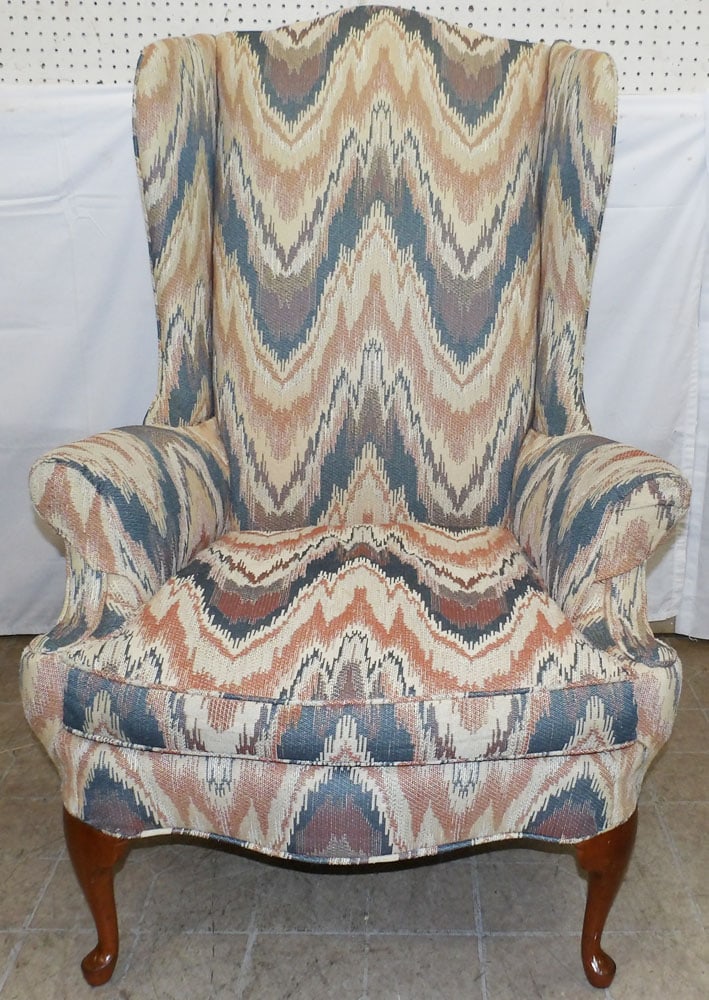 Upholstered Wing Back Arm Chair: Upholstered Wing Back Arm Chair. 47 1/2" H 32 1/2" W 29" H "ALL DESCRIPTIONS AND ANY CONDITION STATEMENT GIVEN BY LANGSTON AUCTION GALLERY ARE STRICTLY OPINIONS AND LANGSTON'S SHALL HAVE NO