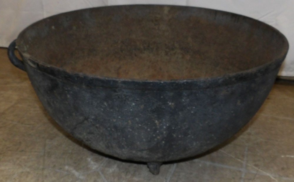 Cast Iron Wash Pot: Cast Iron Wash Pot. 10 3/4" H 22 3/4" Dia. "ALL DESCRIPTIONS AND ANY CONDITION STATEMENT GIVEN BY LANGSTON AUCTION GALLERY ARE STRICTLY OPINIONS AND LANGSTON'S SHALL HAVE NO RESPONSIBILITY FOR ERRORS