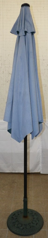 Large Umbrella with Painted Cast Iron Base: Large Umbrella with Painted Cast Iron Base . 96 1/2" H "ALL DESCRIPTIONS AND ANY CONDITION STATEMENT GIVEN BY LANGSTON AUCTION GALLERY ARE STRICTLY OPINIONS AND LANGSTON'S SHALL HAVE NO