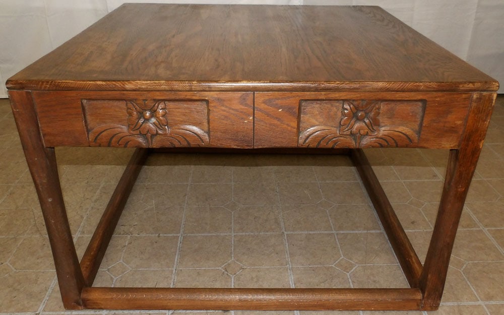 Carved Oak Cocktail Table: Carved Oak Cocktail Table. 22 1/4" H 35" Dia. "ALL DESCRIPTIONS AND ANY CONDITION STATEMENT GIVEN BY LANGSTON AUCTION GALLERY ARE STRICTLY OPINIONS AND LANGSTON'S SHALL HAVE NO RESPONSIBILITY FOR