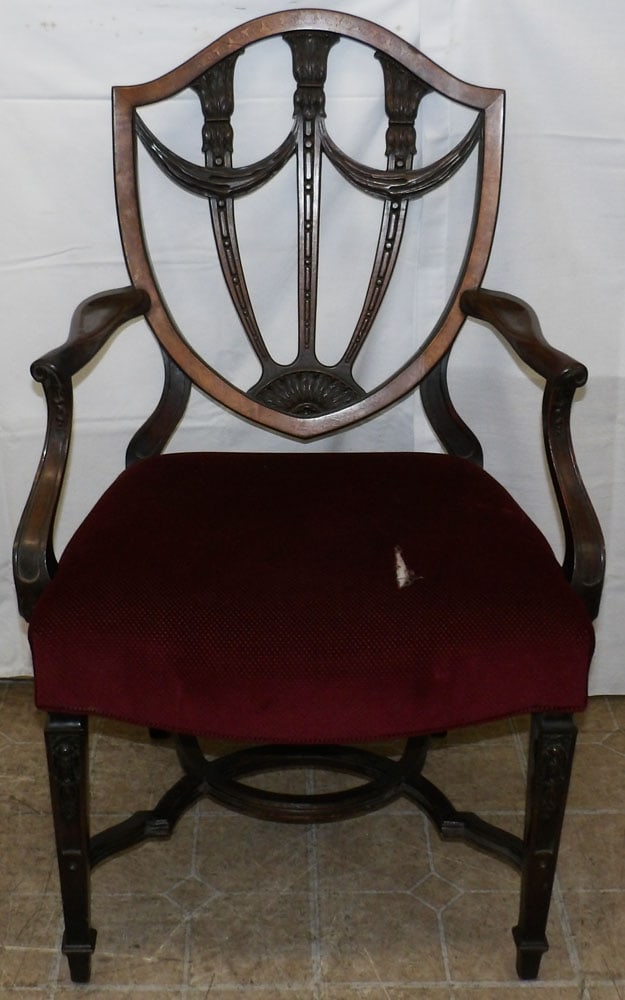 Carved Mahogany Arm Chair: Carved Mahogany Arm Chair . 39" H 25" W 20" D "ALL DESCRIPTIONS AND ANY CONDITION STATEMENT GIVEN BY LANGSTON AUCTION GALLERY ARE STRICTLY OPINIONS AND LANGSTON'S SHALL HAVE NO RESPONSIBILITY FOR